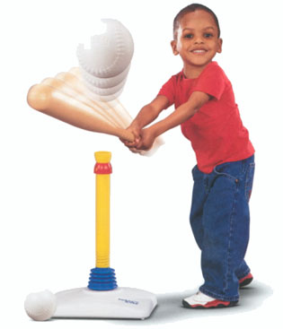 A small child hitting a ball off a t-ball stand